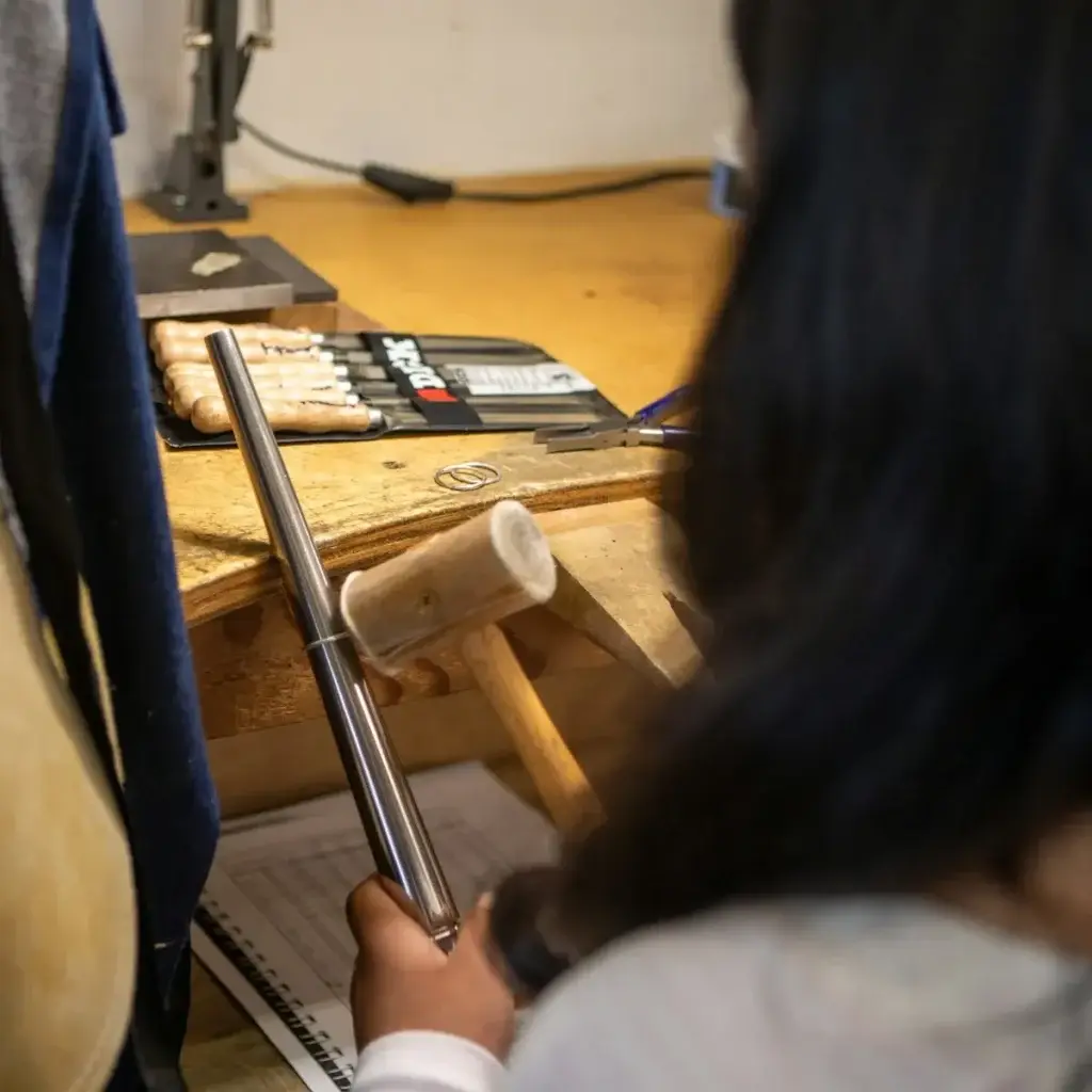 Open air silversmith studio bench with hand tools in Kuta, Bali