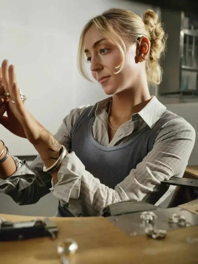 Traveller inspecting her finished handmade silver ring after a Bali silver class in Kuta